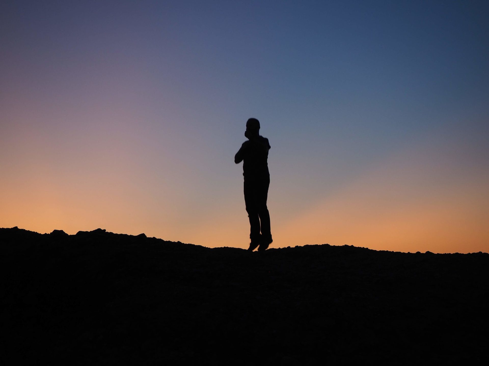 Jumping man at sunset