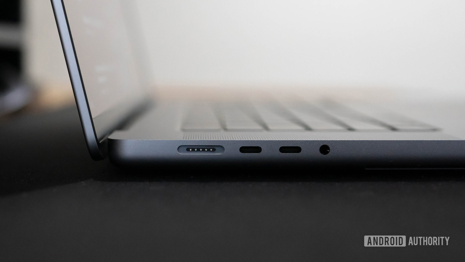 Apple MacBook Pro 2023 left side profile showing MagSafe 3 Thunderbolt 4 USB C ports and 3.5mm headphone port Apple MacBook Pro 2023 left side profile showing MagSafe 3 Thunderbolt 4 USB C ports and 3.5mm headphone port