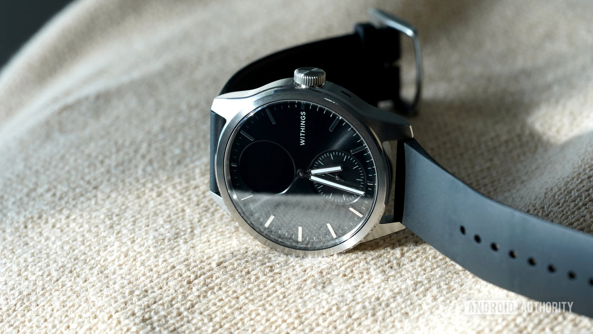 A Withings ScanWatch 2 rests on its side.
